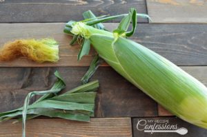 Easy Roasted Corn on the Cob- This is the easiest way to cook corn on the cob. There is no need to husk the corn, just throw it in the oven for 20 -25 minutes. The husk traps the moisture in, resulting in a tender and juicy ear of corn. Once the corn is cooked the husk and silk practically slip right off. After try this recipe, you will never boil corn again! 