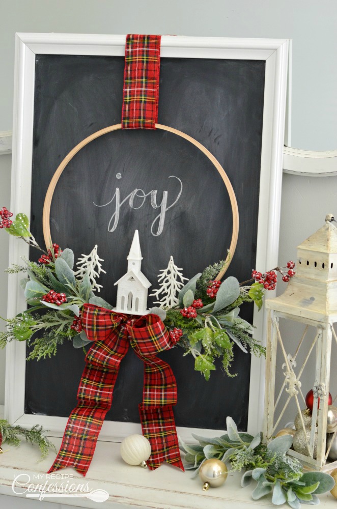 Christmas Embroidery Hoop Wreath will look perfect on your front door! This wreath is super easy and very inexpensive. Some of the supplies were even bought at the Dollar Store. You won't find an easier DIY Christmas project! #Christmaswreath #diycrafts #Christmasdecorating #Christmastime #ChristmasEve #Christmas