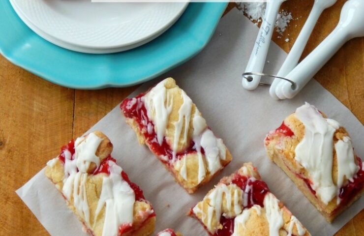 Cherry Kuchen Bars (A.K.A Cherry Pie Bars) are moist pie bars with a rich buttery flavor. The cherry filling and sweet creamy glaze put this dessert over the top. This recipe is one of my favorite go-to desserts. They are so easy but look so complicated. Everybody who tries them loves them!
