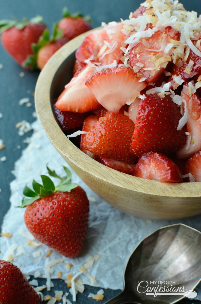 Fresh Strawberry and Toasted Coconut Salad is the easiest fruit salad recipe you will ever make! The toasted coconut is amazing with the fresh strawberries. It's so good you will want to skip dessert and just eat this salad instead!