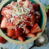 Fresh Strawberry and Toasted Coconut Salad is the easiest fruit salad recipe you will ever make! The toasted coconut is amazing with the fresh strawberries. It's so good you will want to skip dessert and just eat this salad instead!