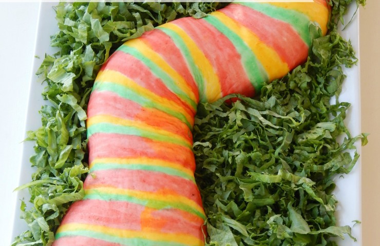 Pizza Stuffed Snake- This easy to follow recipe and tutorial is my boys favorite! You can customize it with your favorite pizza toppings. My kids love to help paint the snake. You will be shocked how simple the food coloring paint is to make. This snake is a great main dish to serve at a Halloween party, birthday party, or Harry Potter party. Serve it with a side of blood a.k.a marinara sauce for a huge party hit!