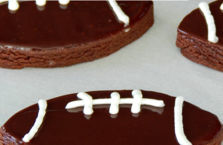 Chocolate Sugar Cookie Footballs. You need these cookies in your life! They are a cross between a sugar cookie and a brownie. I could eat them for breakfast, lunch, and dinner. You always need some delicious desserts at game day. Easy desserts shaped like footballs are even better. These cookies will be a huge hit on game day, I promise!