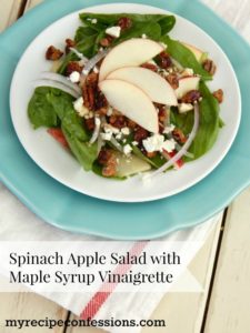 Spinach Apple Salad with Maple Syrup Vinaigrette- Apples, onions, feta cheese, and candied pecans over a bed of spinach with a maple syrup vinaigrette drizzled over the top. This is the best salad recipe! The dressing is super easy to make and it will rock your world!