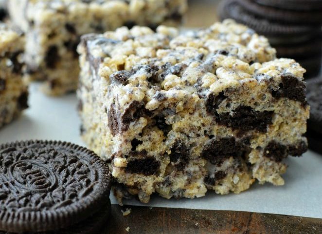 Cookies & Cream Rice Krispie Treats-These are the BEST Rice Krispie Treats EVER! They are soft and gooey with yummy chunks or Oreos throughout. You will not find an easier dessert than this recipe. You can make these babies in under 10 minutes. They are, knock your socks off good!